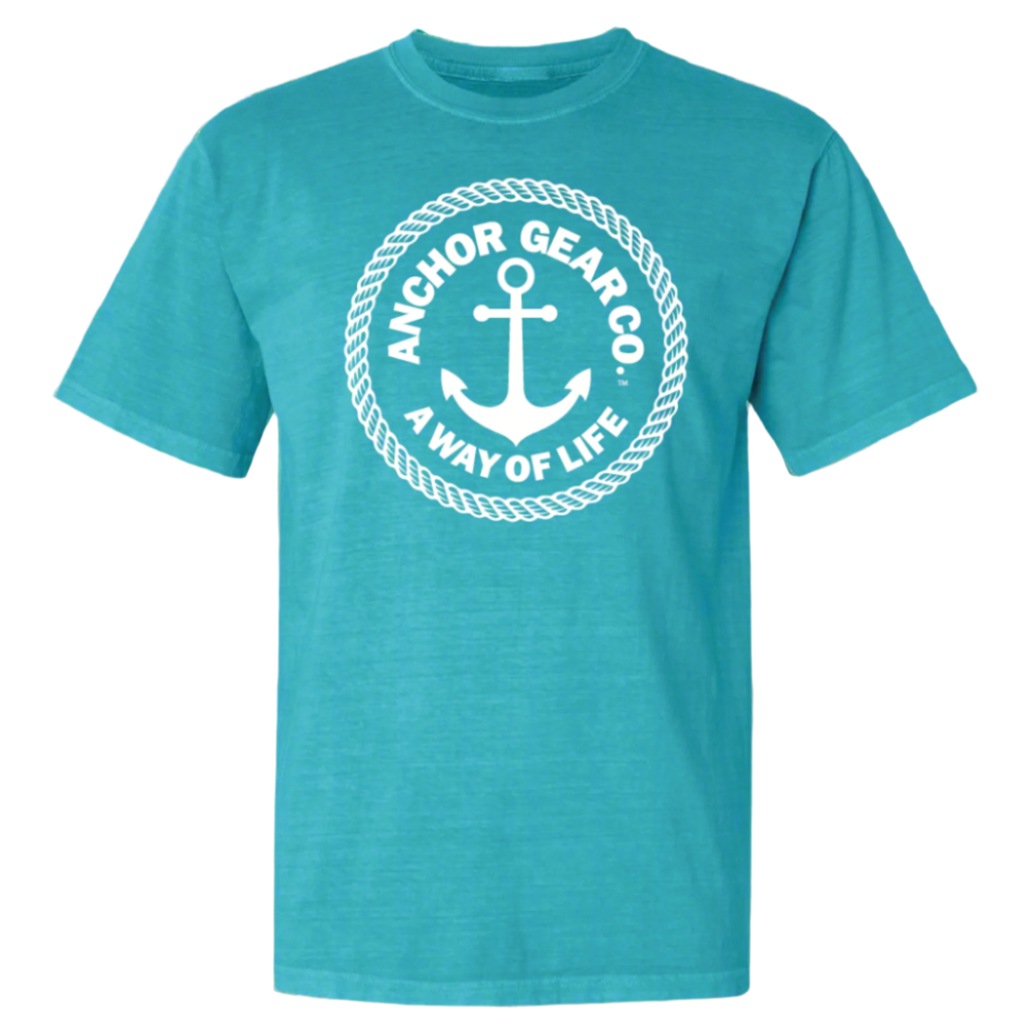 A green crew neck t-shirt with the Anchor Gear Co. logo printed in the center, displayed on a wooden jetty with trees and water in the background.