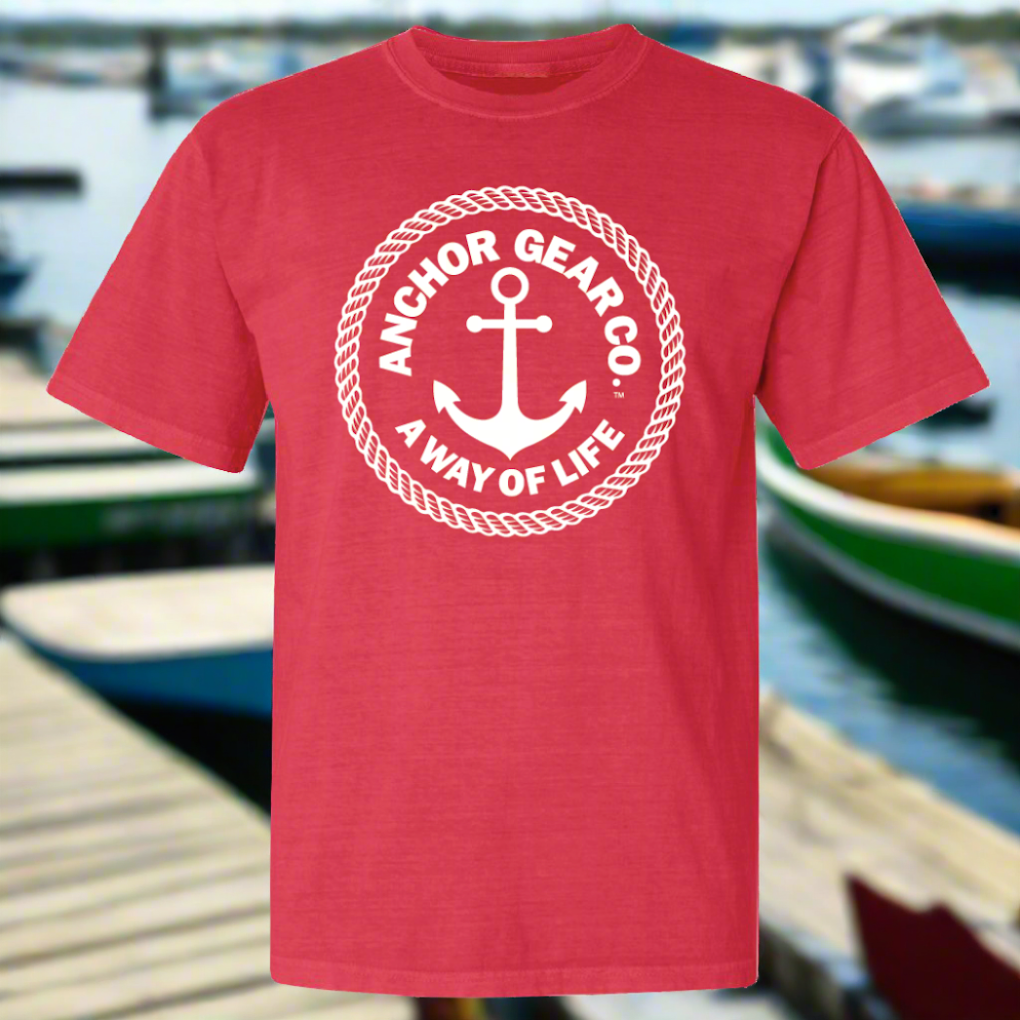 A watermelon colour crew neck t-shirt with the Anchor Gear Co. logo printed in the centre, displayed on white background