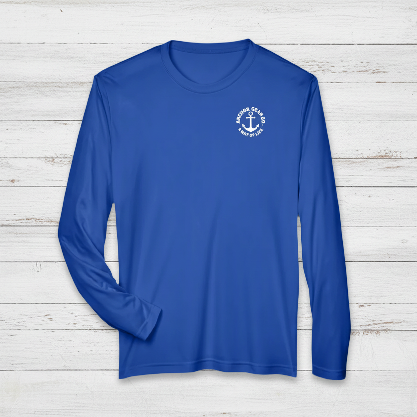 A royal blue long sleeve performance shirt with a anchor design on the chest, displayed on white background
