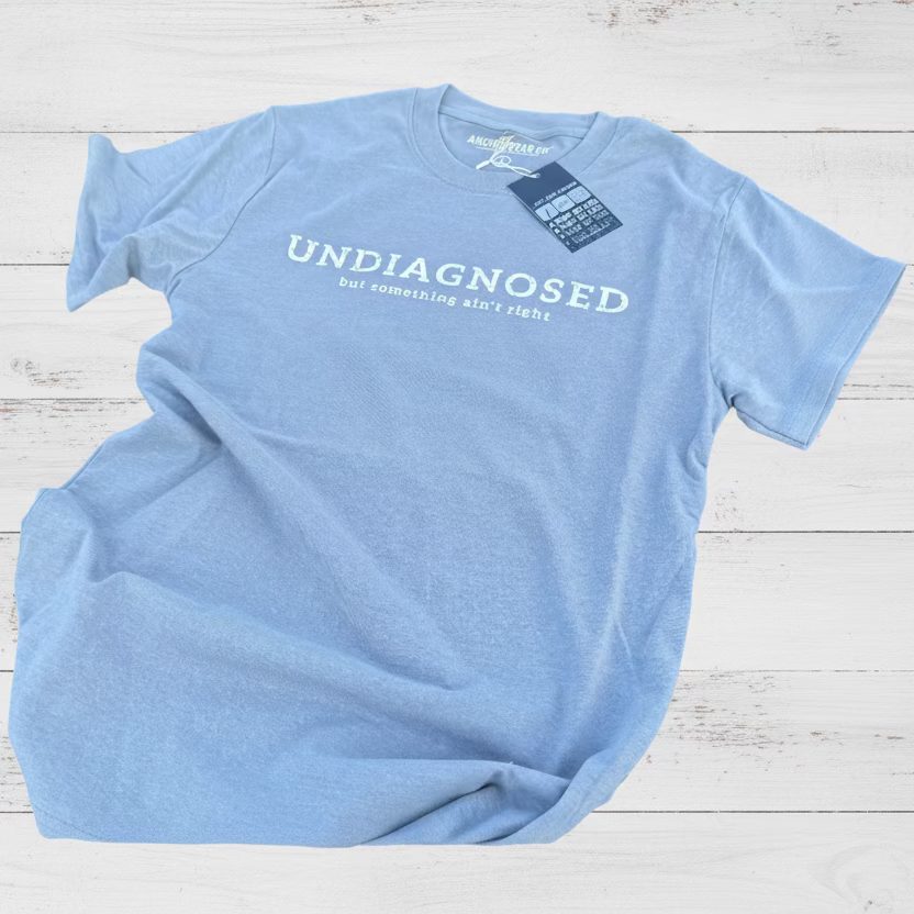 Light blue t-shirt with 'undiagnosed' text on a white background