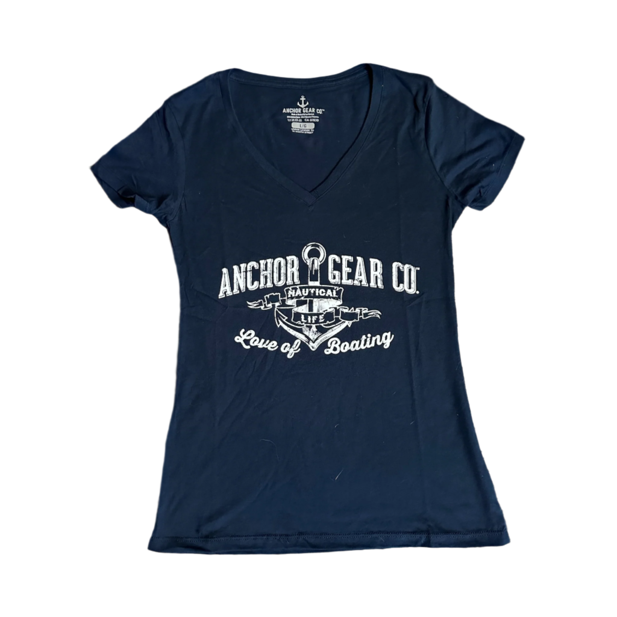 A navy blue fitted women's t-shirt with a v-neck, featuring a white graphic print of an anchor and text, displayed on a wooden surface.