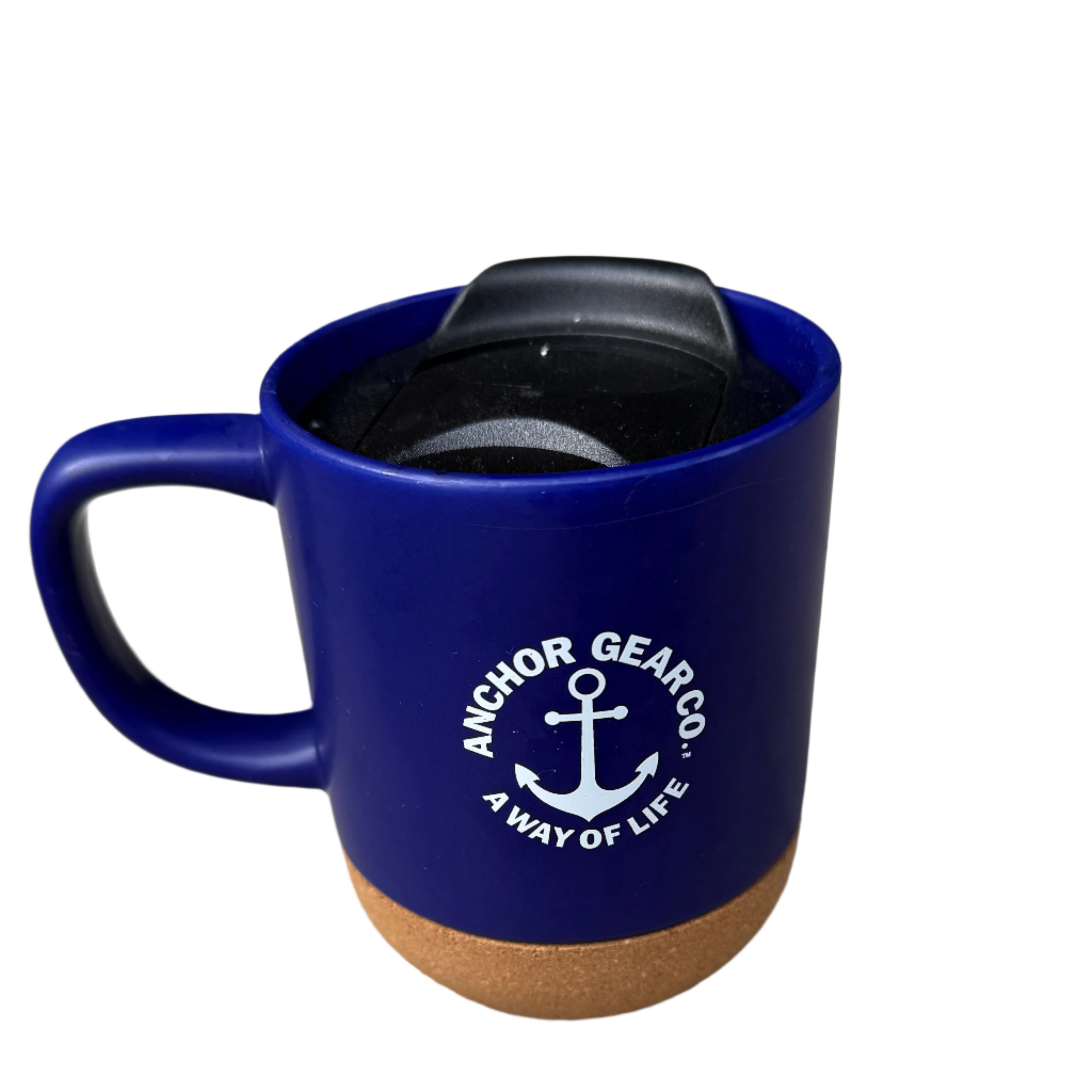 A navy-colored ceramic mug with a cork bottom and a black secure sip lid, featuring the Anchor Gear Co. logo.