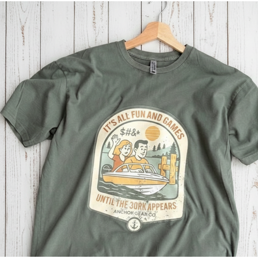 Green t-shirt with graphic design on a wooden surface