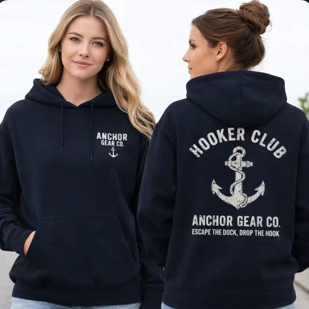 Two people wearing black hoodies with 'Anchor Gear Co.' branding on a plain background.