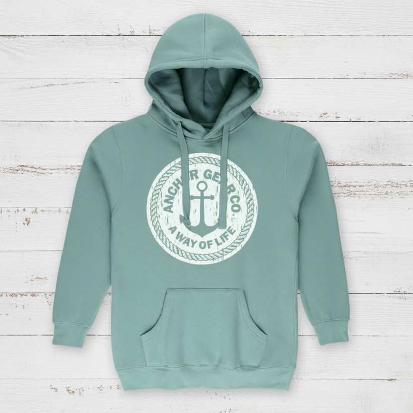 A sage hoodie  featuring a central logo on the chest that contains an anchor and the text 'A Way of Life' surrounding a circular frame.