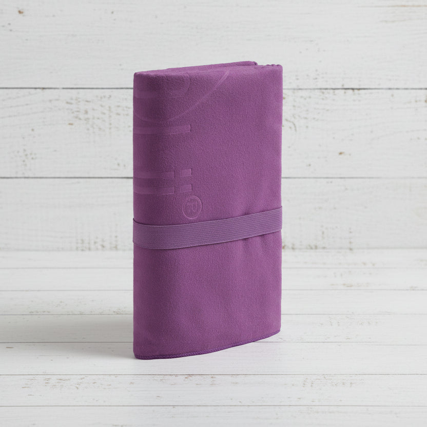Purple fabric item with a strap on a light gray background