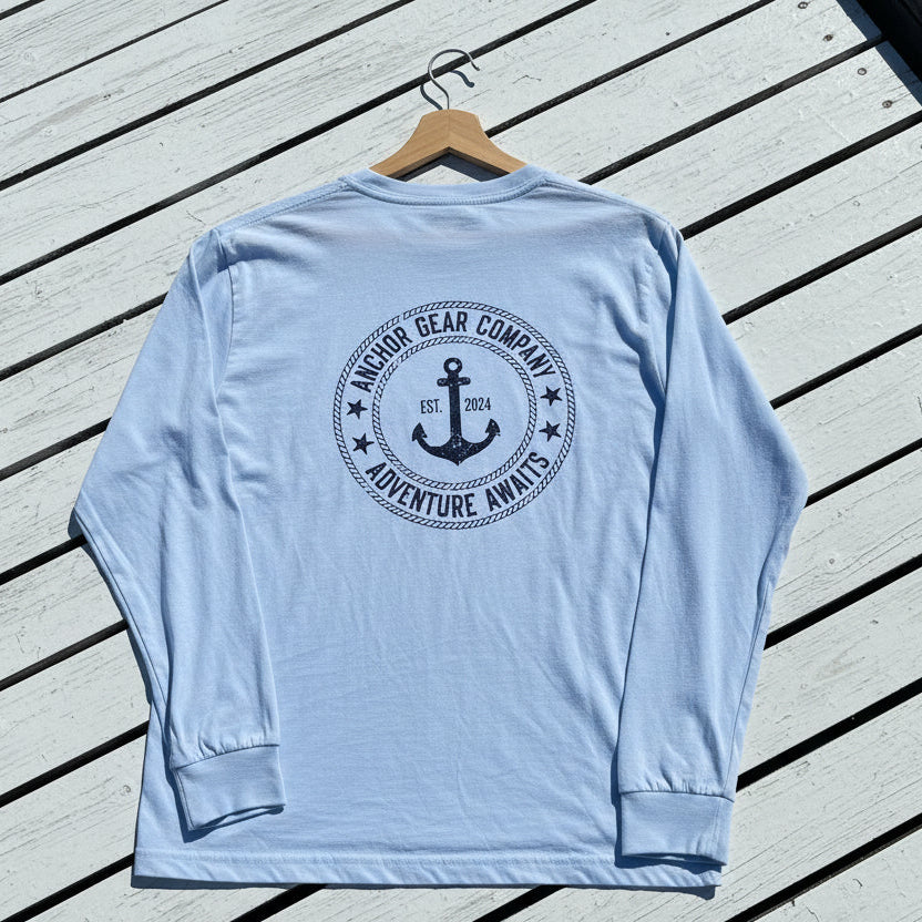 White long-sleeve shirt with an anchor graphic on a white washed boards
