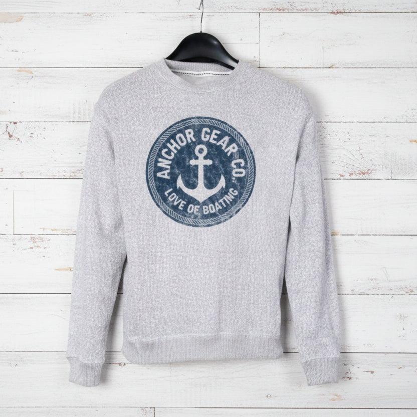 Grey sweatshirt with 'Anchor Gear Co.' logo on a hanger against a white background